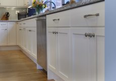 White cabinets in blue kitchen