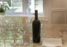 Wine bottle sitting on top of kitchen counter