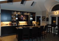 Renovated home bar with a tv