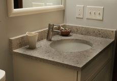 Renovated grey kitchen sink in bathroom