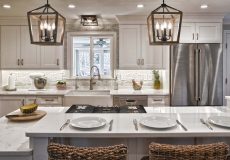 Modern white kitchen with hanging lights